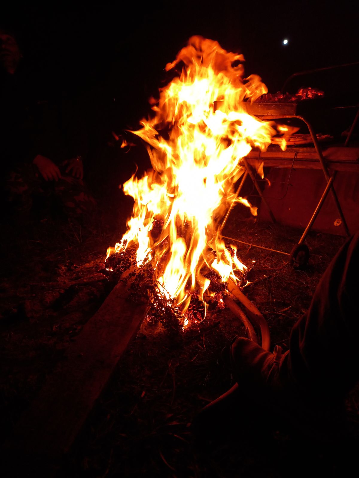 Bonfire glowing under the night sky