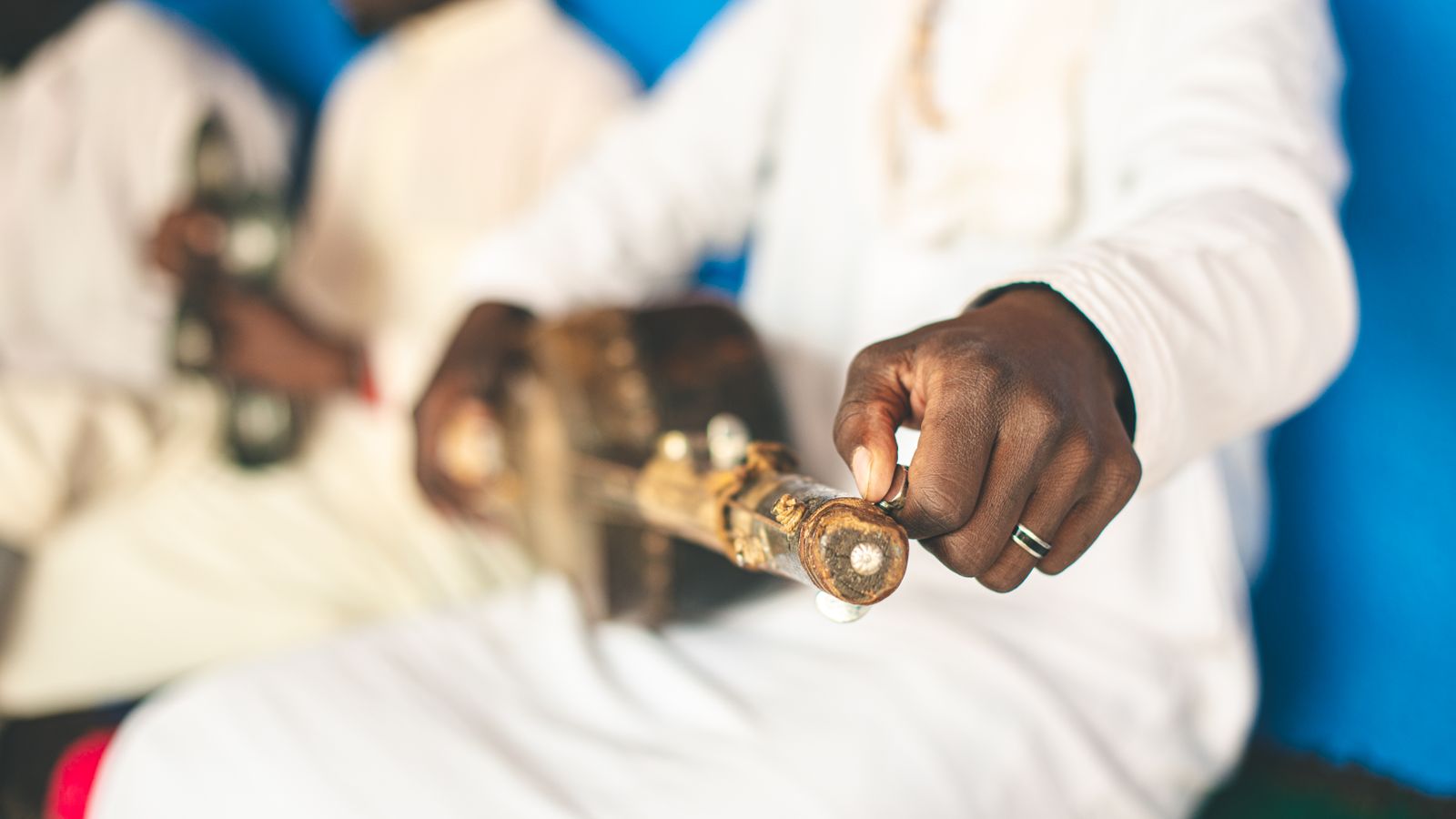 A man holding a handmade guitar, Mali