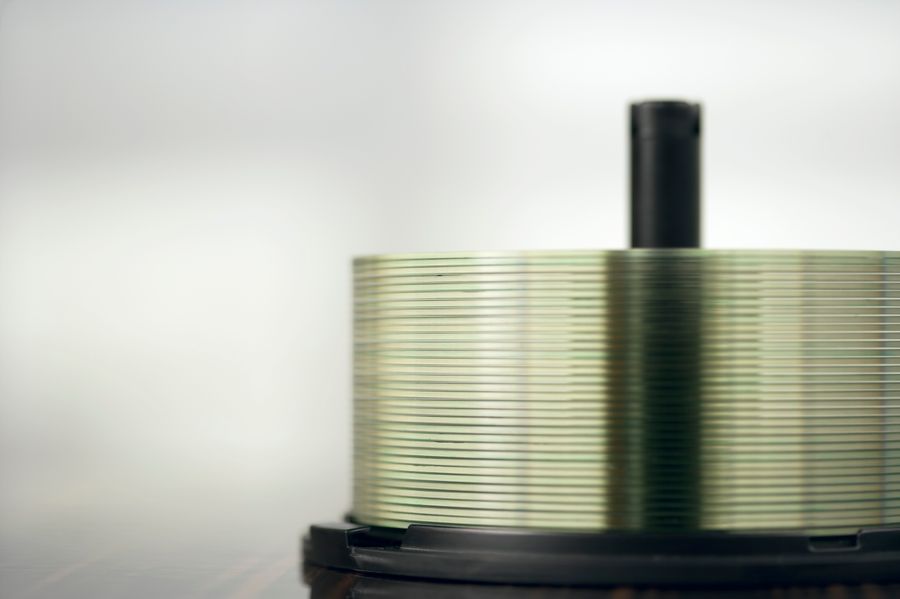 A stack of compact discs on a spindle