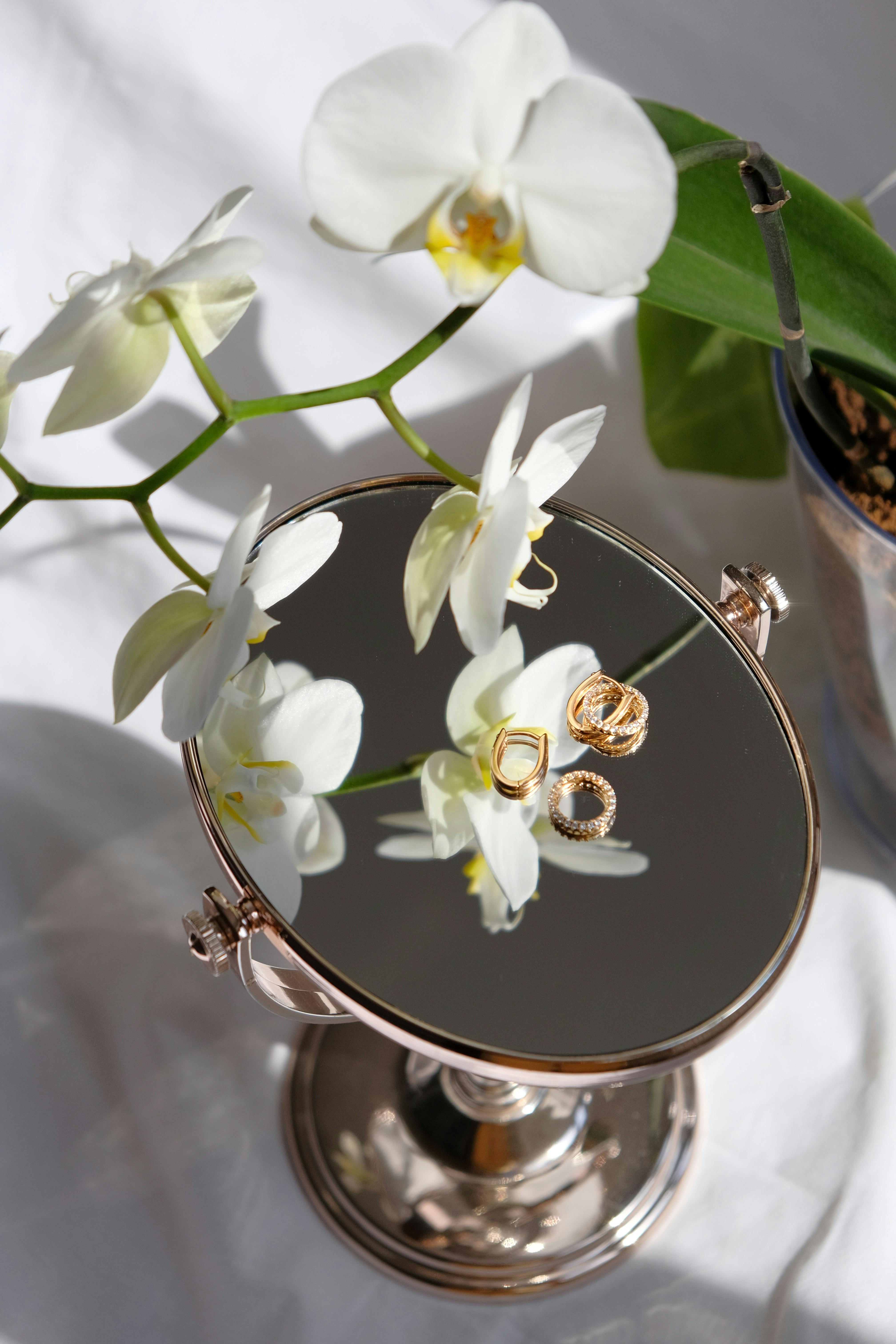 earrings on top of a vanity mirror