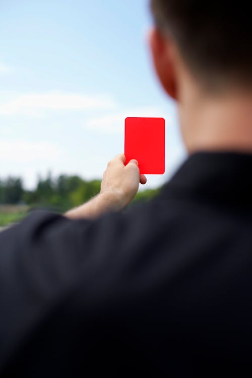 Referee hand(red card) Stock Photo