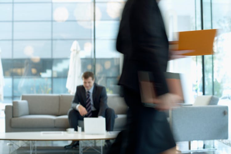 Businessman In Suit Sitting In The Lounge 