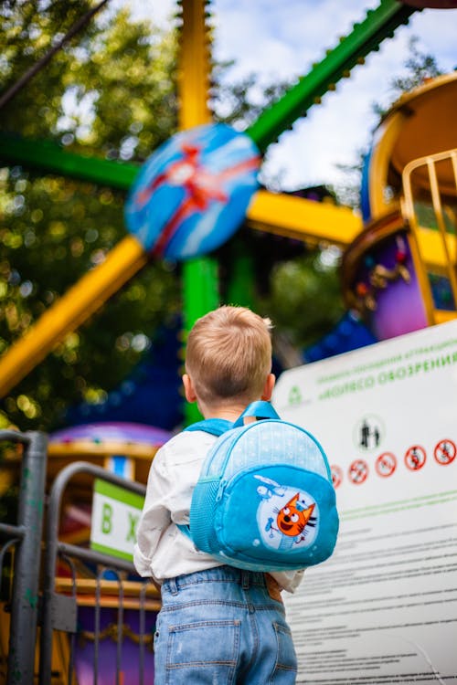 Boy Carrying a Blue Backpack