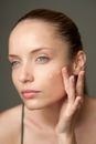 Woman Applying Foundation