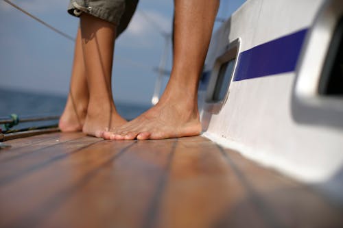 People Feet Standing on Vessel