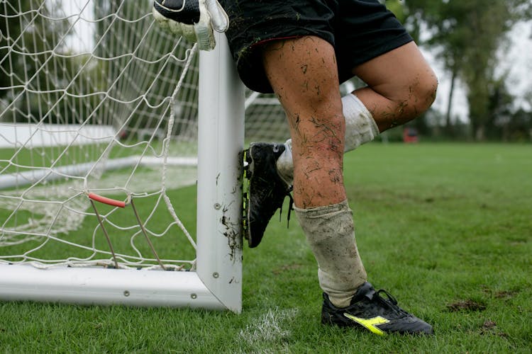 Dirty Legs Of Soccer Player