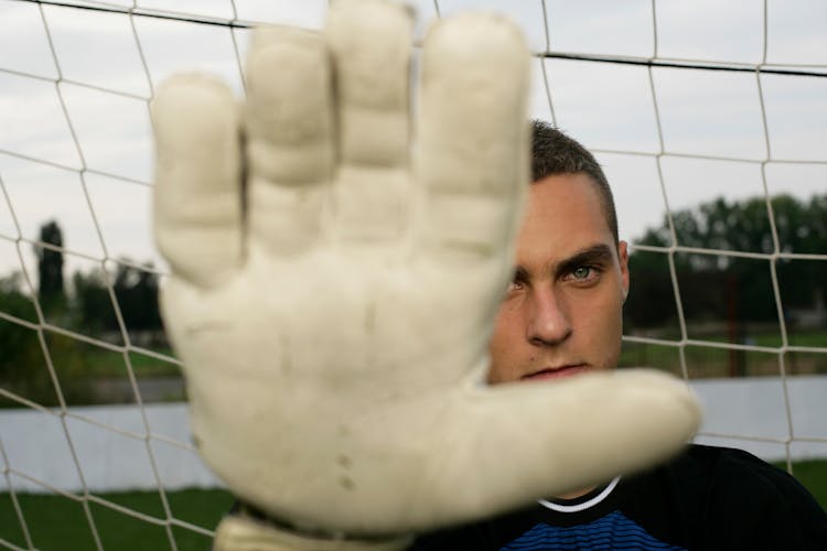 A Goalie Wearing A Glove