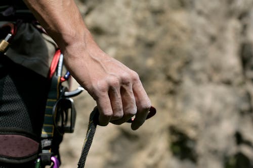 Hand Holding Climbing Rope