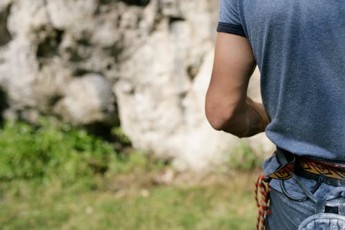 Back View of Man near Rock