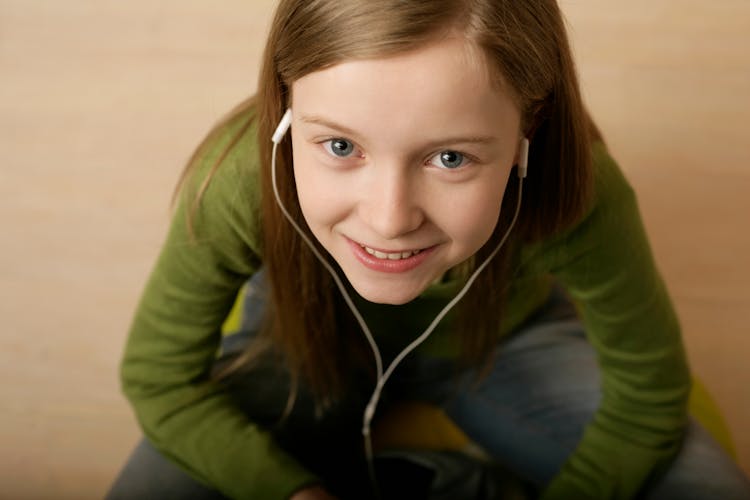 Teenage Girl Listening To Music On Her Headphones 