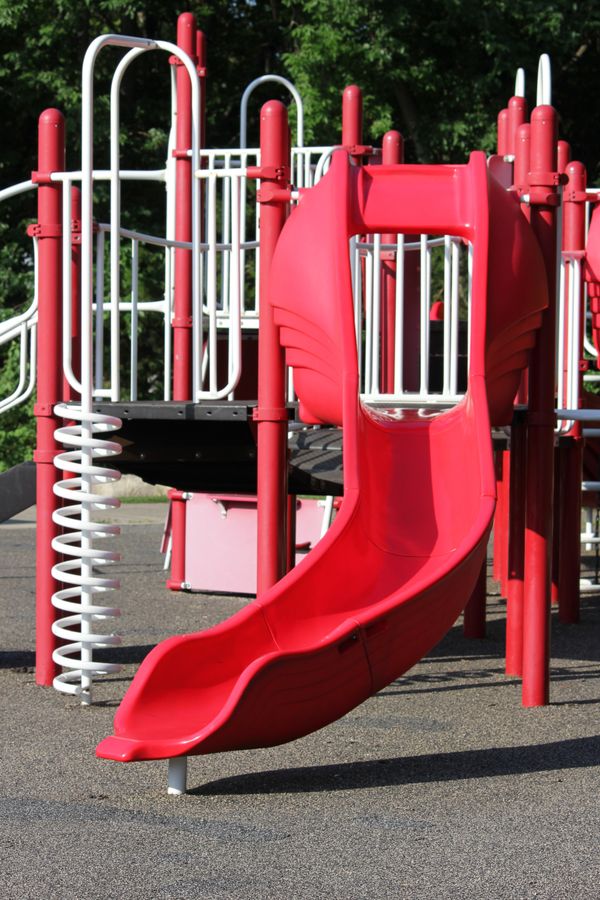 Red and white commercial playground slide