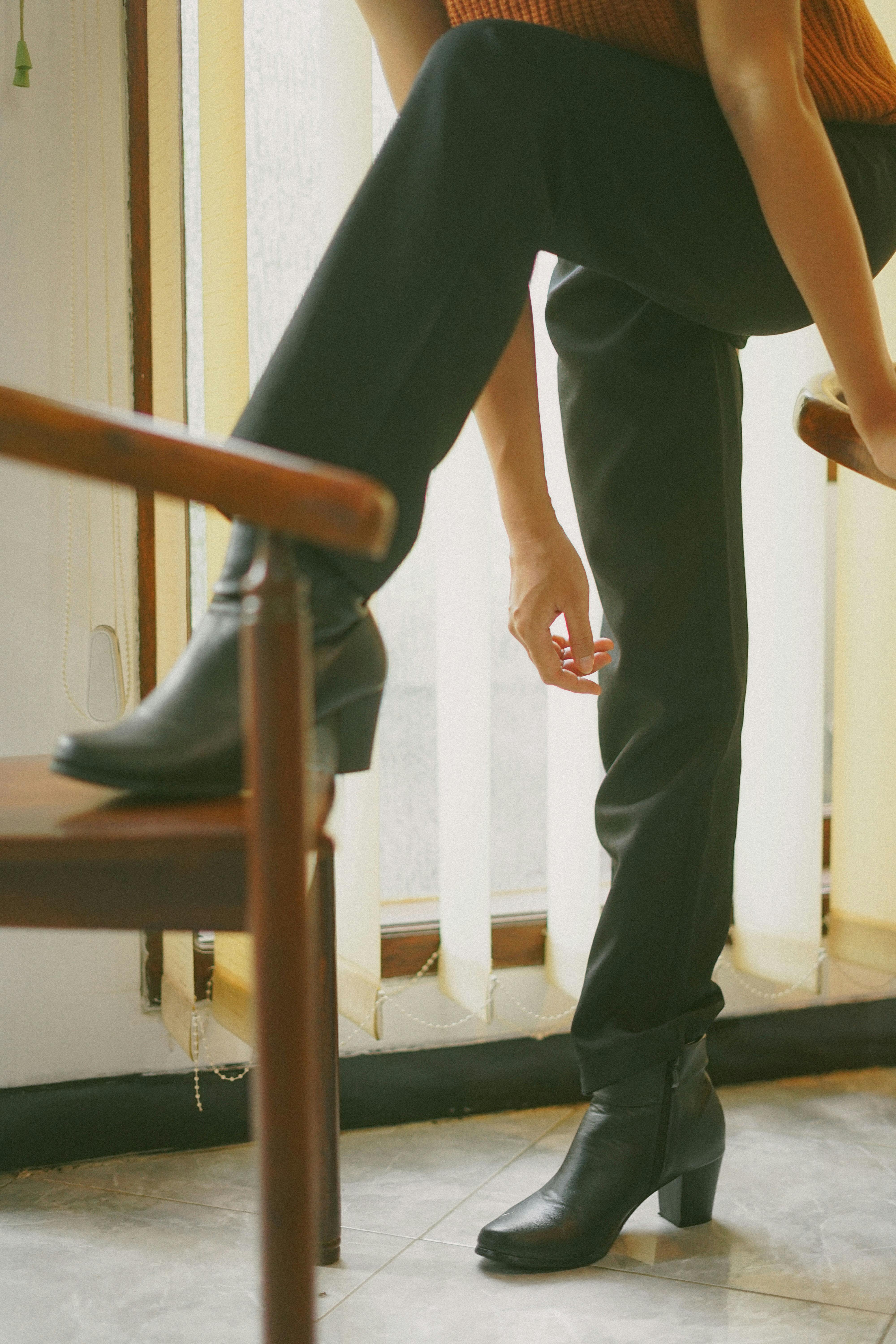 Person wearing white leather chelsea booties and black pants photo  Free  Boots Image on Unsplash