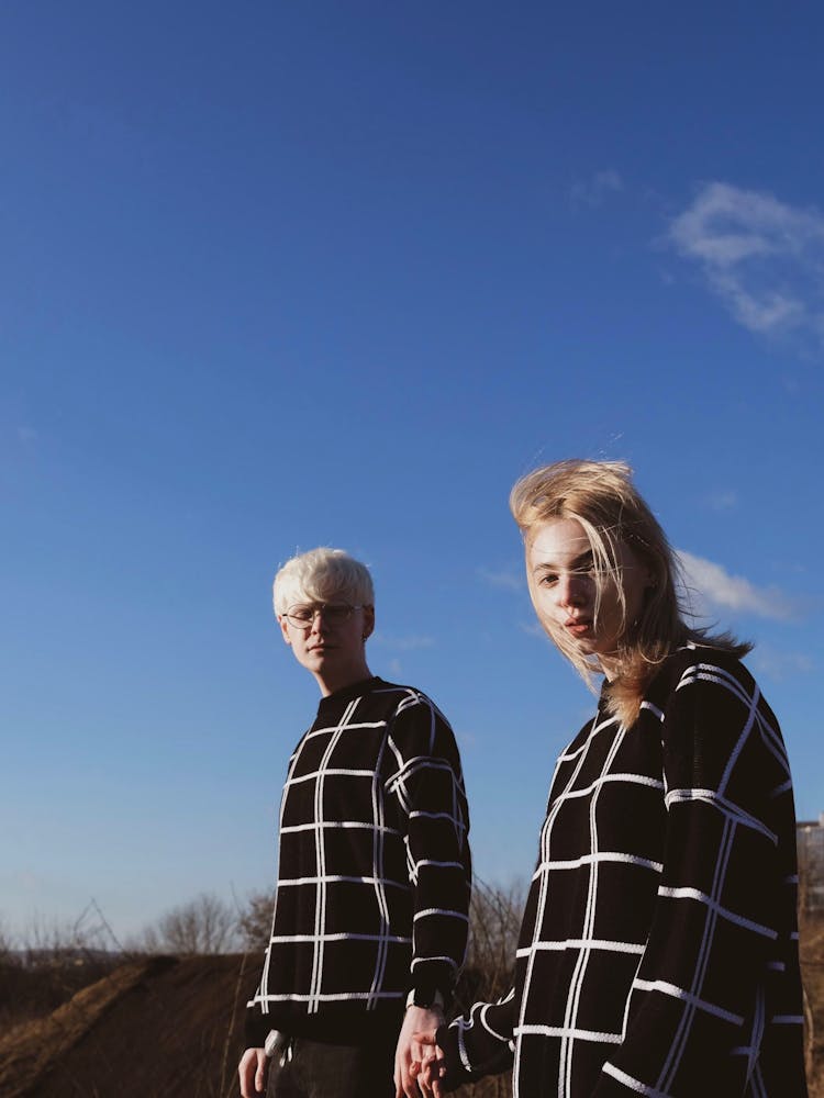 Couple Wearing Matching Blouses