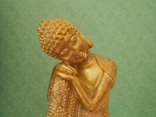 Free Gold Buddha Figurine in Close Up Shot Stock Photo