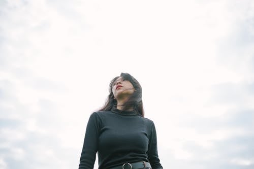 A Woman in Black Long Sleeve Shirt