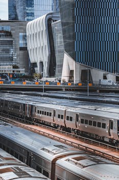 View of a bustling train station amid modern architecture in New York City.