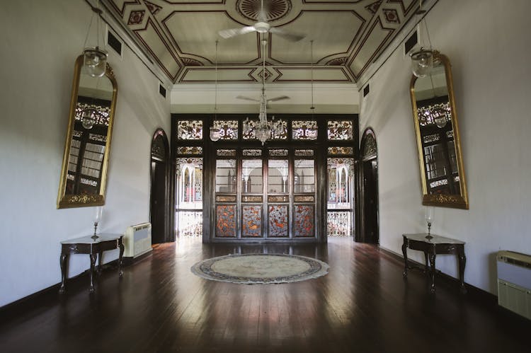 Mirrors And Chandelier In Room