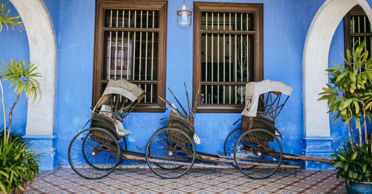 Penang George Town shophouse interior with traditional Peranakan tiles and wooden furniture