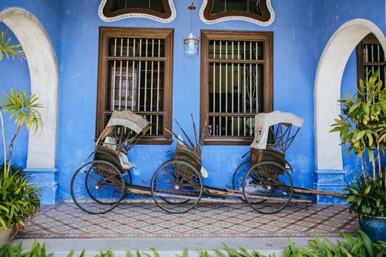 Rickshaws And Blue Wall