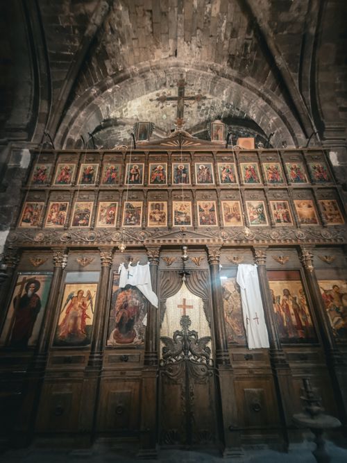 Free Ornate historic Christian altar adorned with religious icons and a prominent cross. Stock Photo