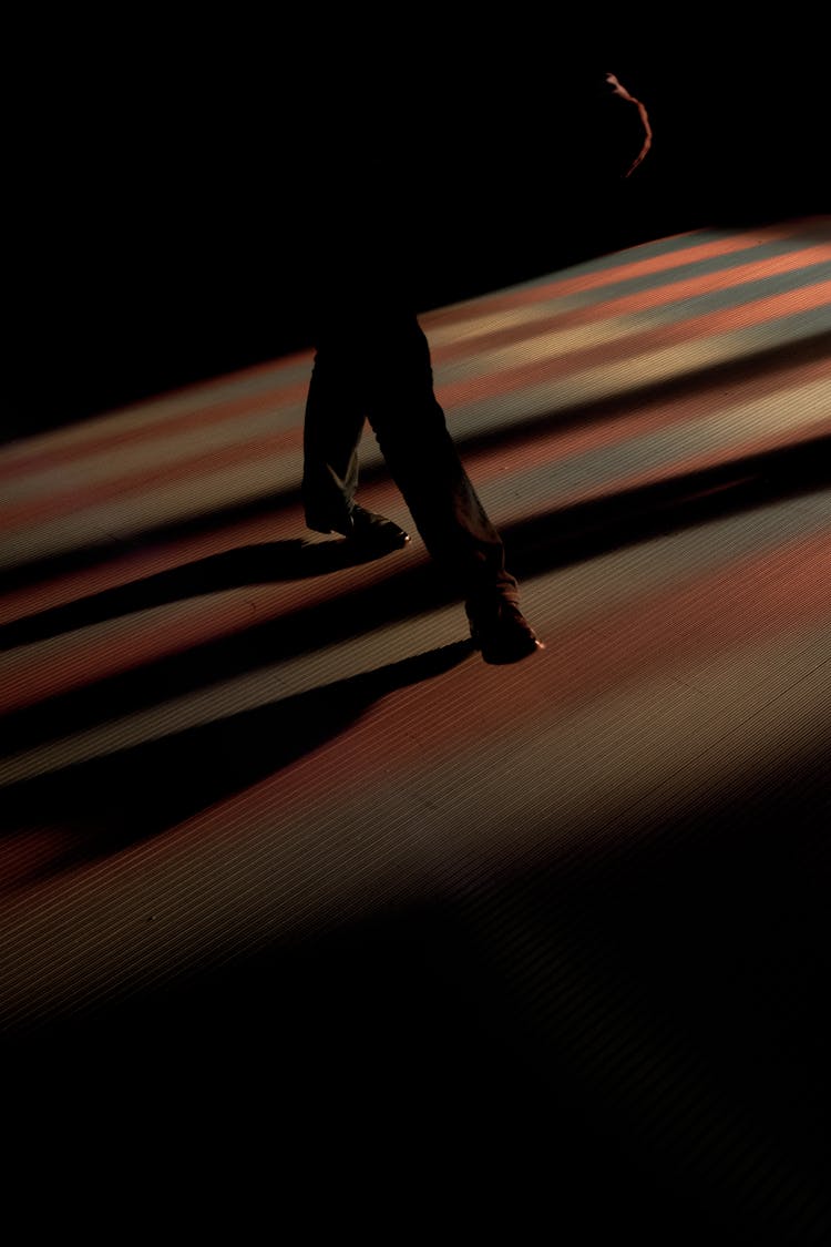 Man Walking In A Shadow 