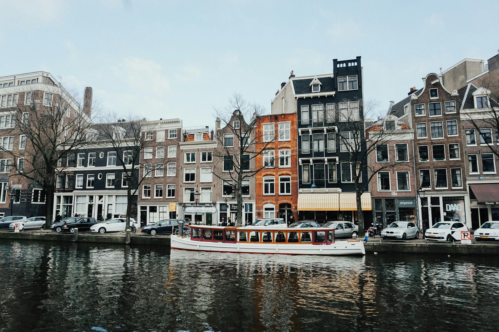 White And Brown Wooden Boat On Body Of Water