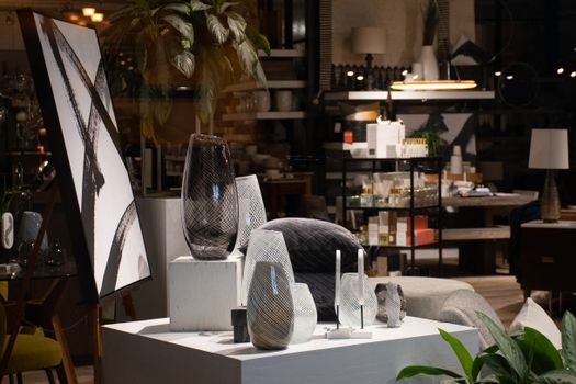 A stylish interior design store display featuring vases and modern artwork, showcasing home decor inspiration.