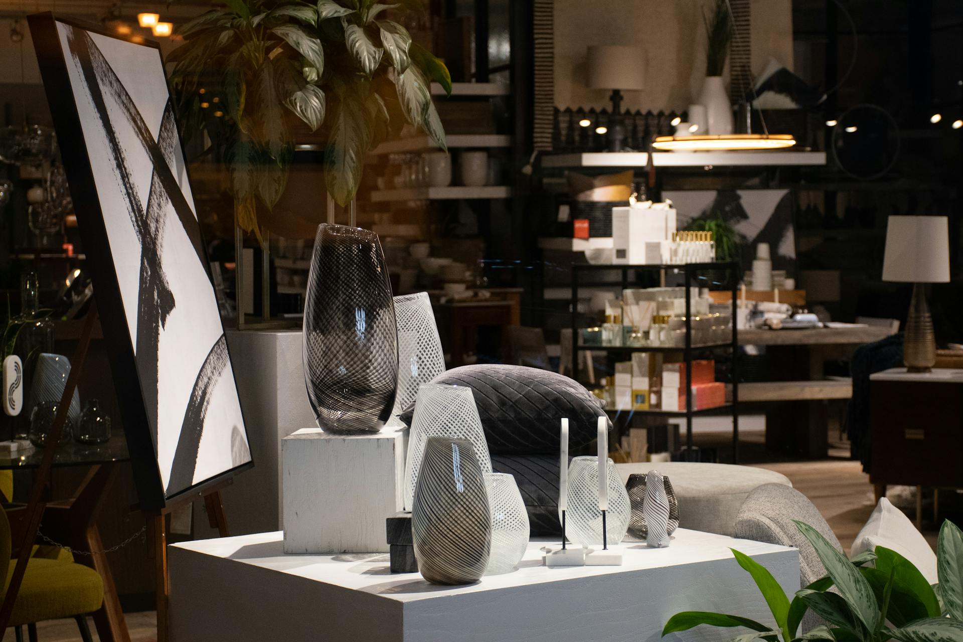 A stylish interior design store display featuring vases and modern artwork, showcasing home decor inspiration.