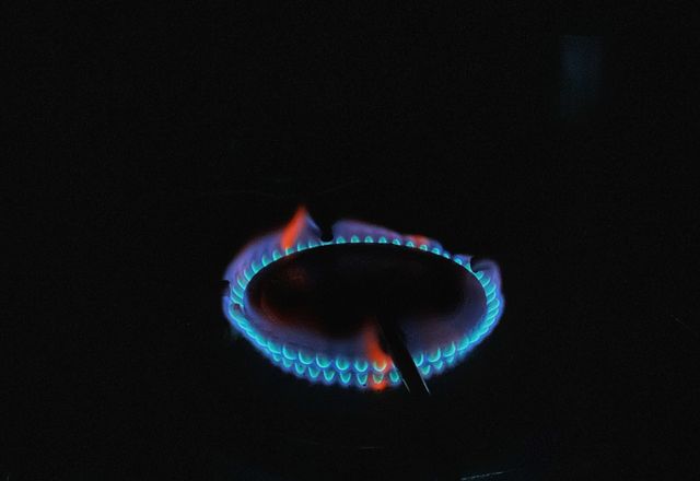 Blue flame on a gas stove burner