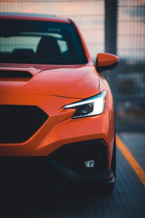 Orange Car in Close Up Photography