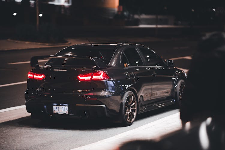 Mitsubishi Lancer Evolution On The Street At Night