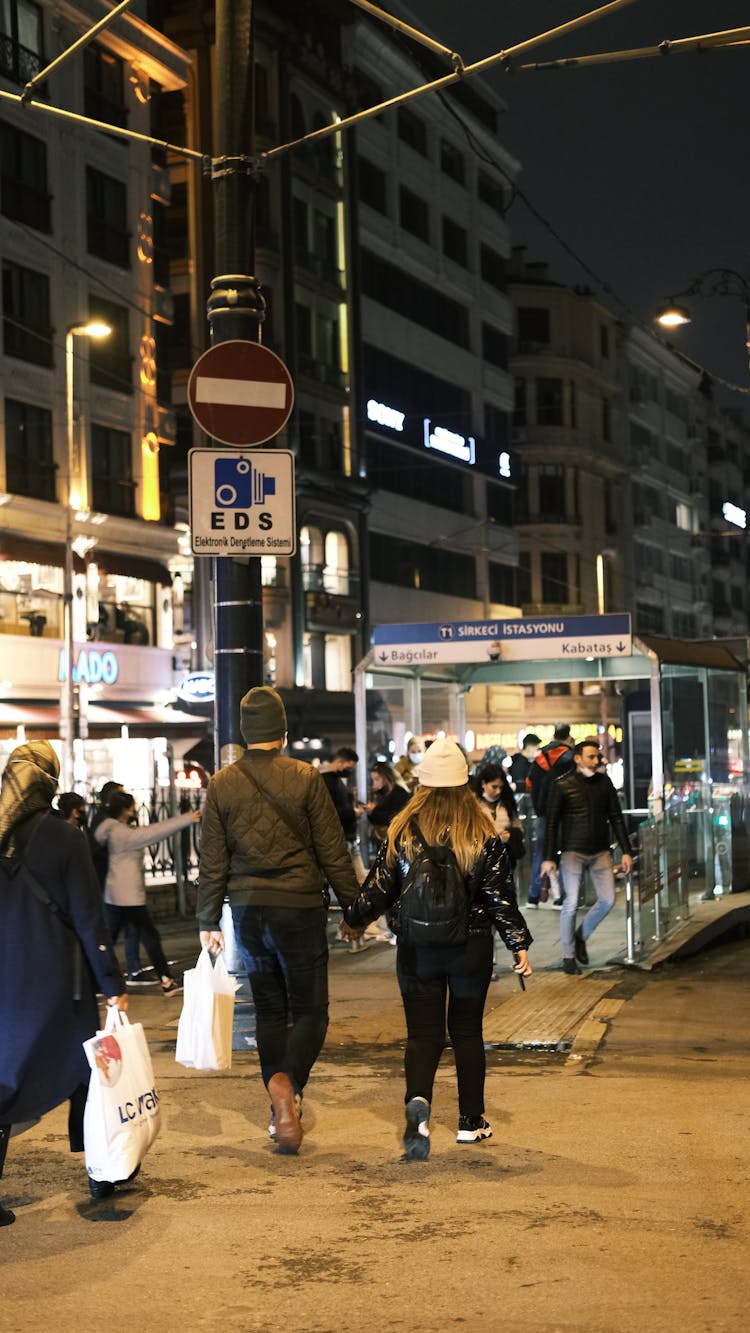 Couple Walking Towards Metro Station In Istanbul At Night