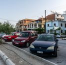 Street view of Zante, Greece showcasing parked cars and charming architecture.