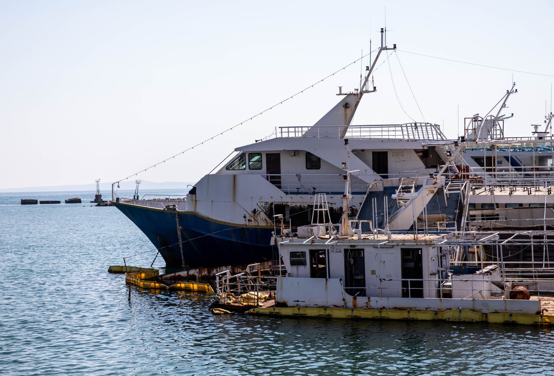 A serene view of docked ships in Zante, Greece, showcasing maritime industry at a quiet harbor.