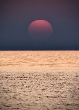 Captivating view of the sun setting over the Adriatic Sea in Durres, Albania, showcasing vibrant colors.