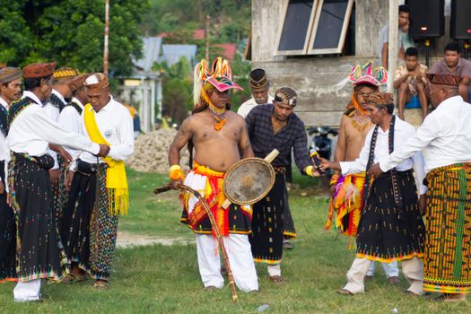 Men performing the vibrant Caci dance in Nusa Tenggara, Indonesia.