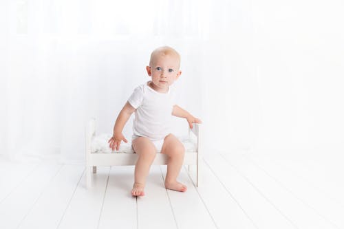 Free Baby Sitting on Bench Stock Photo