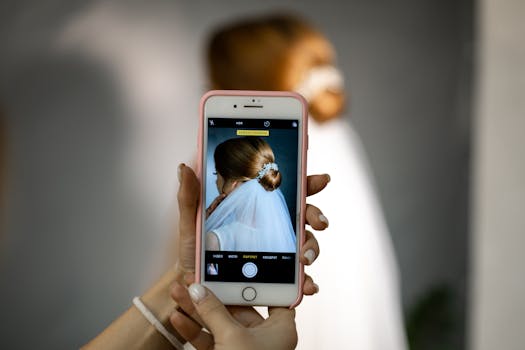 A bridal portrait taken with a smartphone, focusing on the bride's hairstyle.