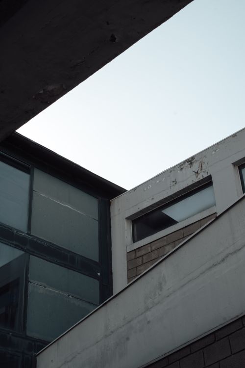 Free Dynamic view of industrial architecture showcasing modern geometric forms in urban Greece. Stock Photo
