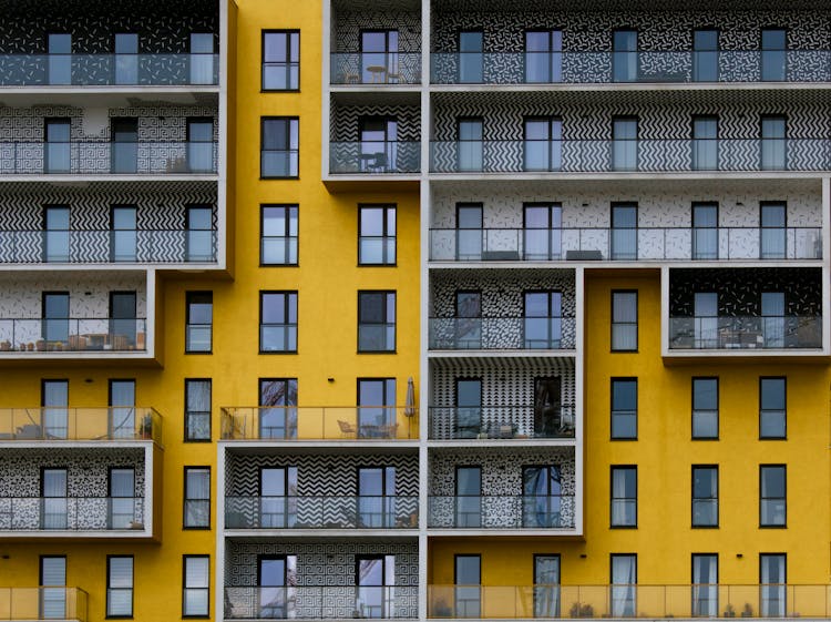 Close Up Photo Of Black And Yellow Concrete Building