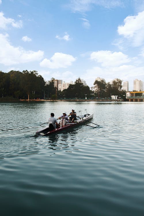 People Riding on Boat on Body of Water