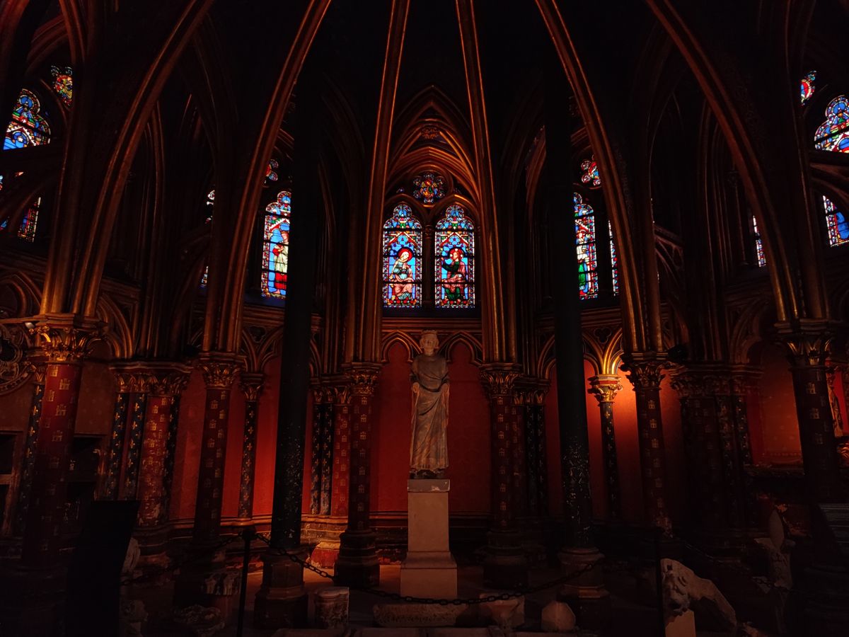 Sainte-Chapelle's stained glass — 1,113 panels that fill the chapel with colored light each morning.