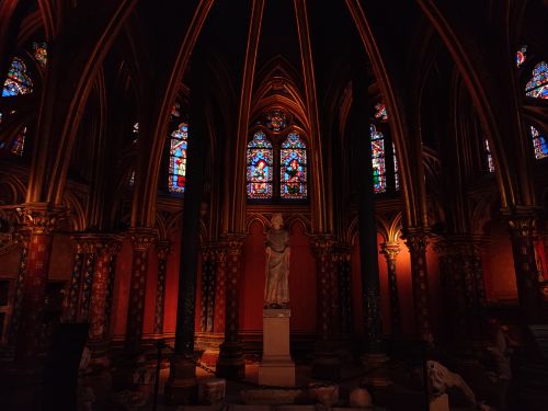 Free Gothic interior of Sainte-Chapelle in Paris with vibrant stained glass windows and sculptures. Stock Photo