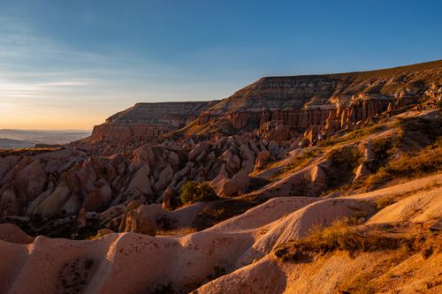 Free Stunning landscape of Kizilcukur Valley at sunset, showcasing its unique rock formations in Cappadocia, Türkiye. Stock Photo