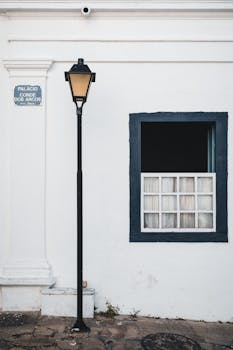 Iconic street lamp and window at Palácio Conde dos Arcos in Goiás, Brazil.