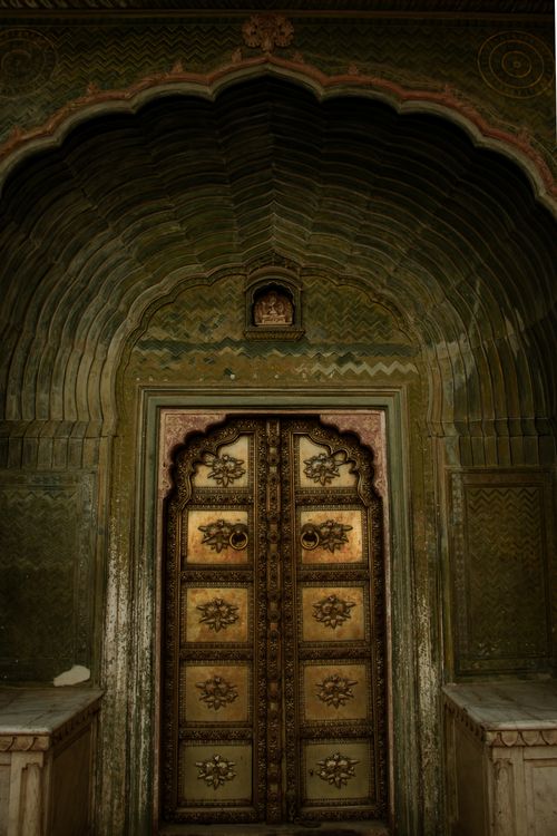 Free Intricately carved doorway with arch in traditional Indian architectural style. Perfect for cultural or historical themes. Stock Photo