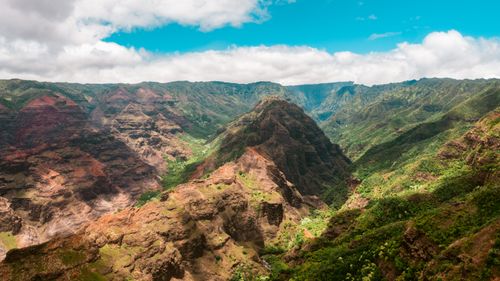 Free Breathtaking aerial view of Waimea Canyon's vibrant cliffs and lush greenery in Hawaii. Stock Photo