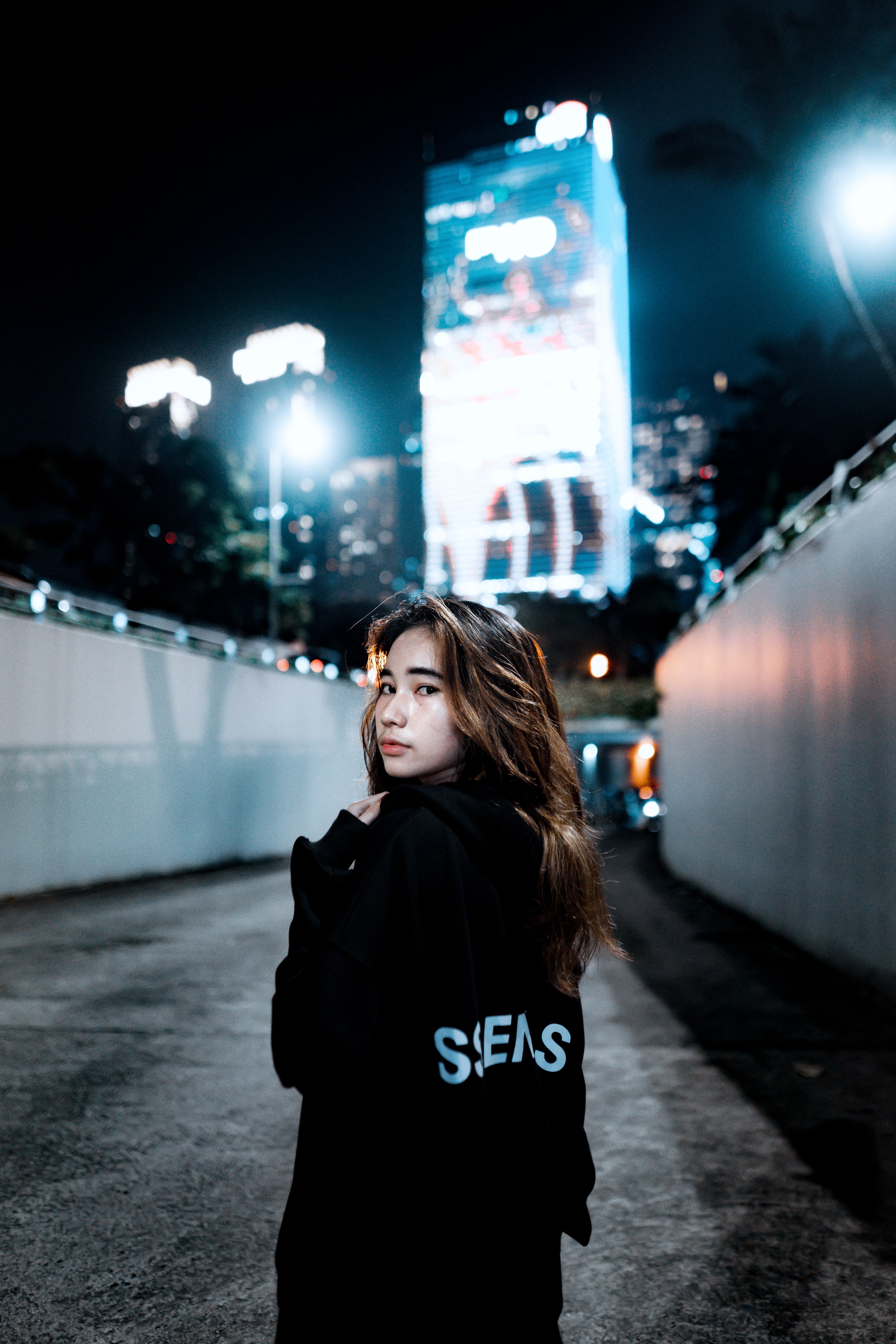 Woman Standing on City Street at Night · Free Stock Photo