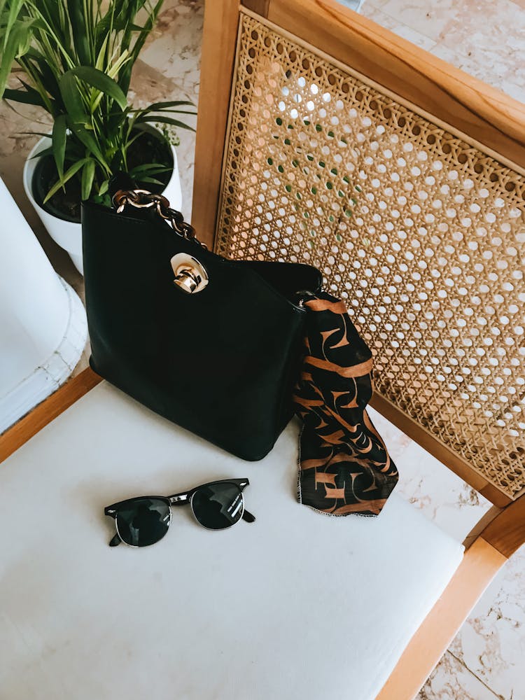 Purse And Sunglasses On The Chair 