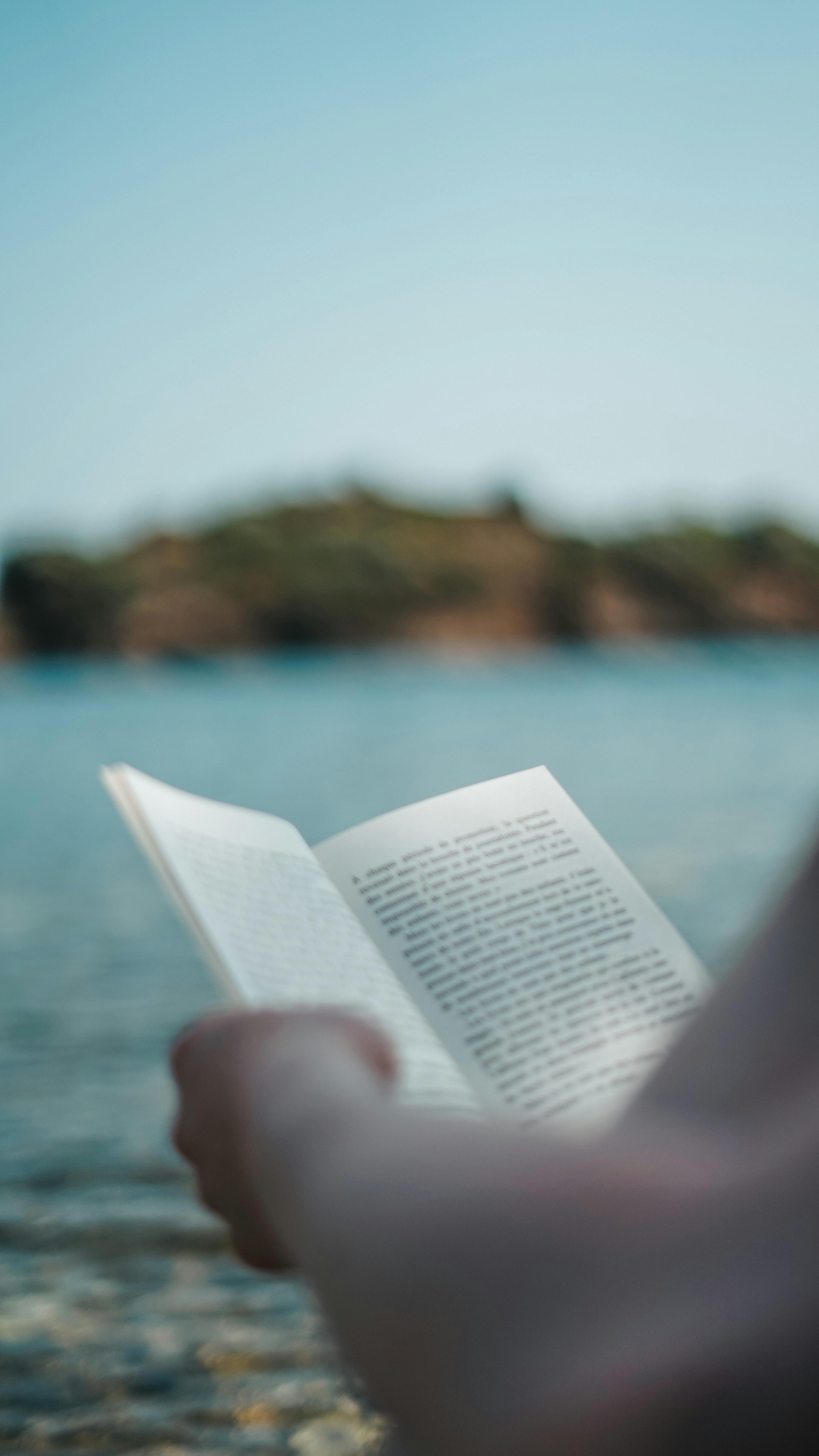 Woman Holding a Book · Free Stock Photo